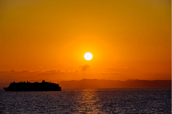 Cruise ship at sunset 1853190443
