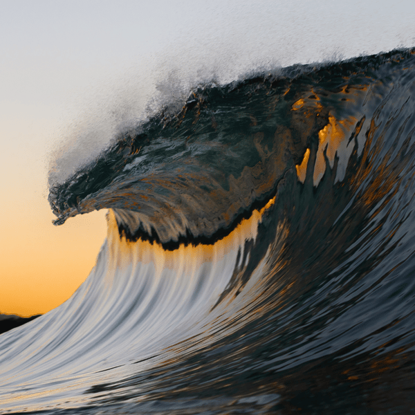 Ocean wave with sunset background